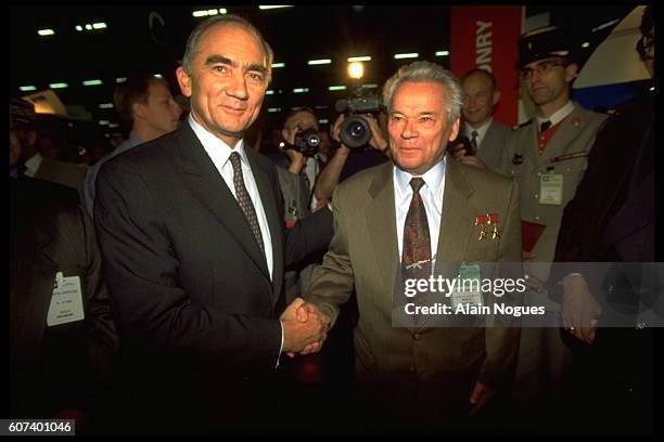 French Minister of Defence Charles Millon with Russian Lieutenant General Mikhail Kalashnikov, most famous for designing the AK-47 assault rifle, the...