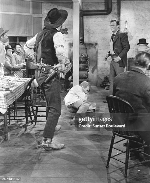 American actors Lee Marvin, James Stewart and John Wayne on the set of The Man Who Shot Liberty Valance directed and produced by John Ford.