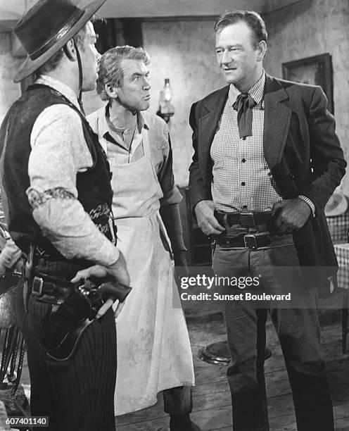 American actors Lee Marvin, James Stewart and John Wayne on the set of The Man Who Shot Liberty Valance directed and produced by John Ford.