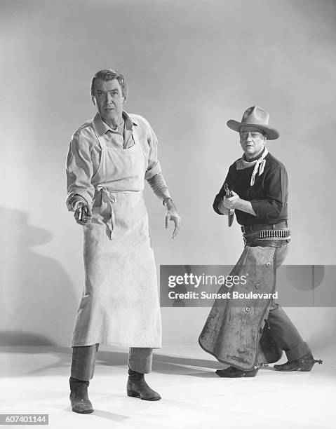 American actors James Stewart and John Wayne on the set of The Man Who Shot Liberty Valance directed and produced by John Ford.