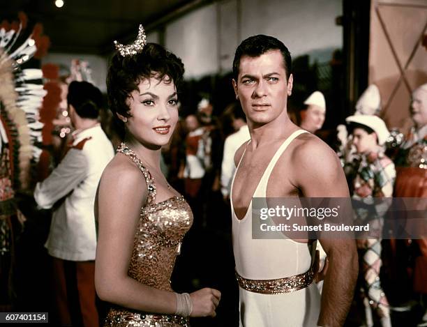 Italian actress Gina Lollobrigida and American actor Tony Curtis on the set of Trapeze, based on the novel by Max Catto and directed by Carol Reed.