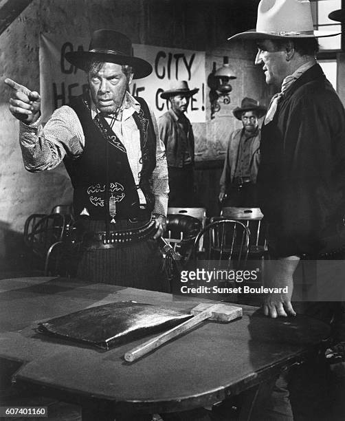 American actors Lee Marvin, Lee Van Cleef and John Wayne on the set of The Man Who Shot Liberty Valance directed and produced by John Ford.