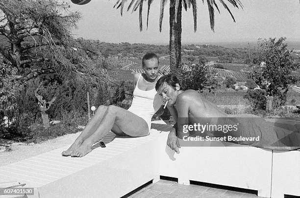 Austrian-born German actress Romy Schneider and French actor Alain Delon on the set of La Piscine directed by Jacques Deray.