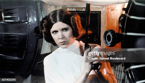 American actress Carrie Fisher on the set of Star Wars: Episode IV - A New Hope written, directed and produced by Georges Lucas.