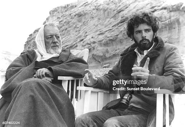 British actor Alec Guinness with American director, screenwriter and producer George Lucas on the set of his movie Star Wars: Episode IV - A New Hope.