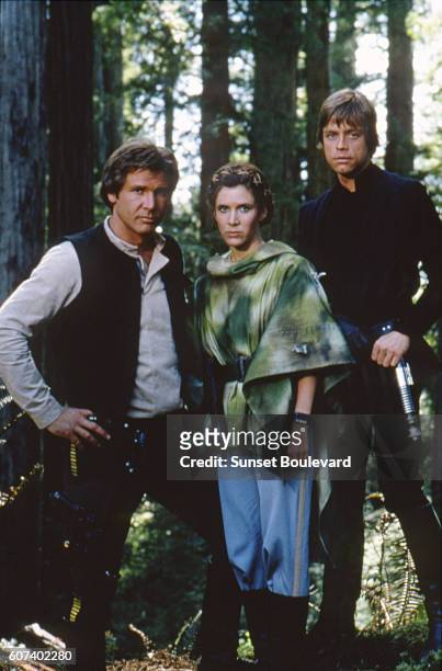 American actors Harrison Ford, Carrie Fisher and Mark Hamill on the set of Star Wars: Episode VI - Return of the Jedi directed by Welsh Richard...