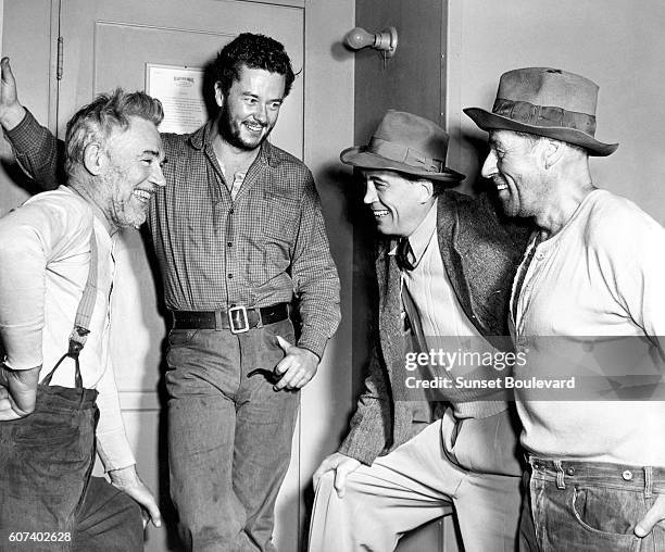 American actors Tim Holt, Walter Huston with his son director and screenwiter John Huston on the set of his movie The Treasure of the Sierra Madre.