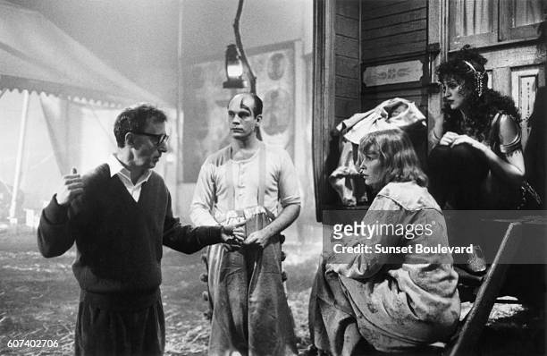 American actors John Malkovich, Mia Farrow and actress and singer Madonna with with actor, director and screenwriter Woody Allen on the set of his...