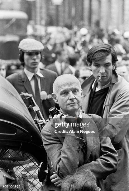 Photographer Henri Cartier-Bresson stands by with his camera during the 1968 Paris riots. In May of 1968, angry students and workers took to the...