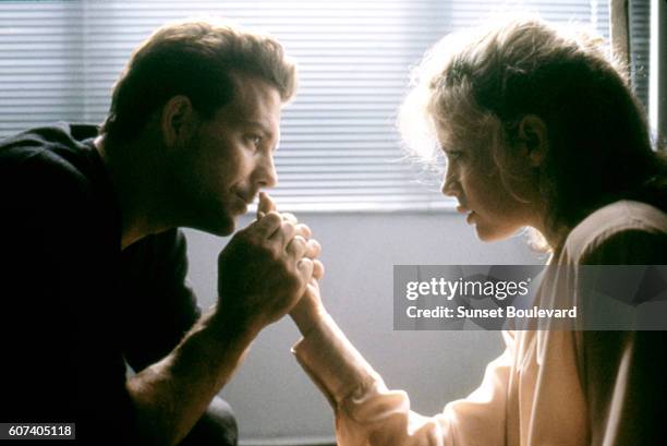 American actors Mickey Rourke and Kim Basinger on the set of Nine 1/2 Weeks directed by Adrian Lyne.