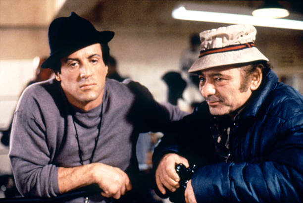 American actor Burt Young with actor and screenwriter Sylvester Stallone on the set of Rocky V directed by John G. Avildsen.