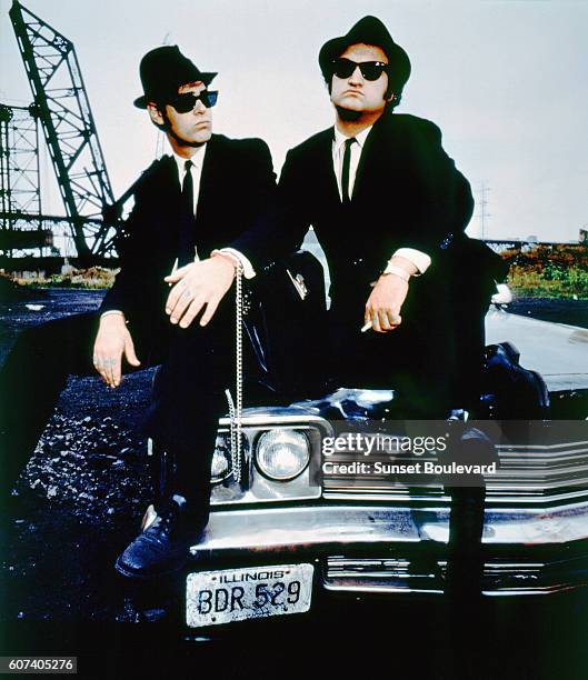 Canadian actor and screenwriter Dan Aykroyd and American actor John Belushi on the set of The Blues Brothers directed by John Landis.