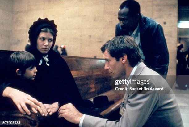 American actors Lukas Haas, Kelly McGillis and Harrison Ford on the set of Witness directed by Peter Weir.