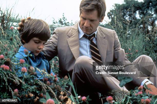 American actors Lukas Haas and Harrison Ford on the set of Witness directed by Peter Weir.