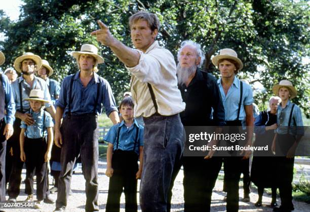 Russian-American ballet dancer and actor Alexander Godunov, American actors Lukas Haas, Harrison Ford and Danish-American Viggo Mortensen on the set...