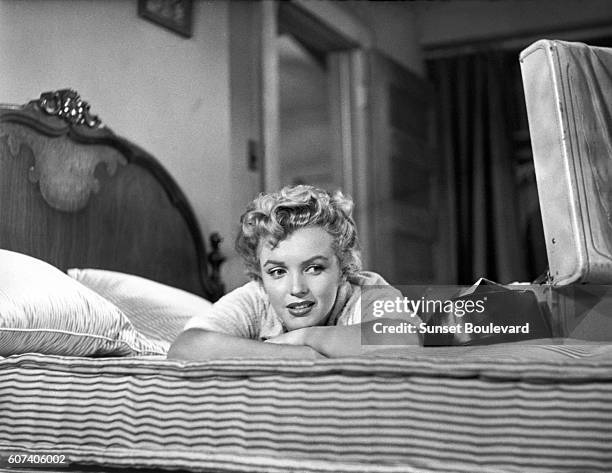 American actress, singer, model Marilyn Monroe on the set of Clash by Night, directed by Austrian-American Fritz Lang.