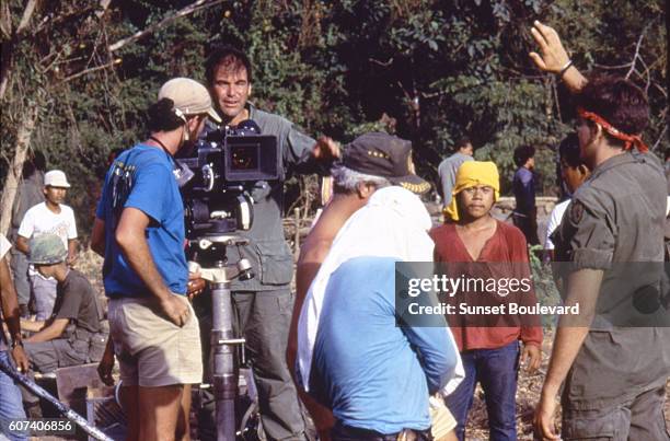 American actor Charlie Sheen with director and screenwriter Oliver Stone on the set of his movie Platoon.