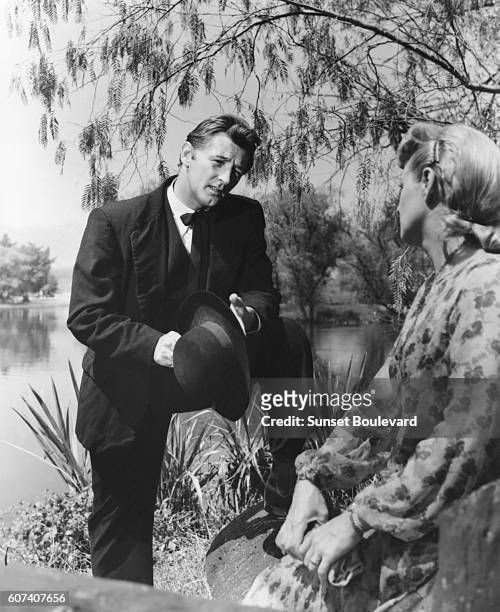 American actors Robert Mitchum and Shelley Winters on the set of The Night of the Hunter, based on the novel by Davis Grubb and directed by Charles...