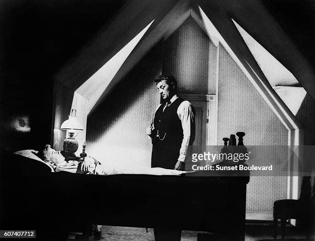 American actors Shelley Winters and Robert Mitchum on the set of The Night of the Hunter, based on the novel by Davis Grubb and directed by Charles...