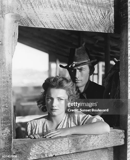 American actors Anne Baxter and Gregory Peck on the set of Yellow Sky, directed by William A. Wellman.