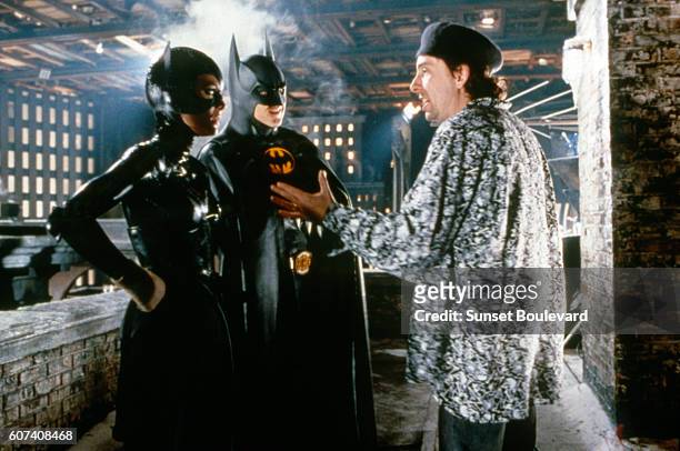 American actors Michelle Pfeiffer and Michael Keaton with director Tim Burton on the set of his movie Batman Returns.