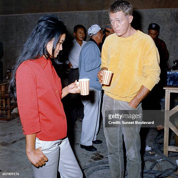 French actress and novelist of Eurasian origin Marayat Andriane aka Emmanuelle Arsan and American actor Steve McQueen on the set of The Sand Pebbles,...