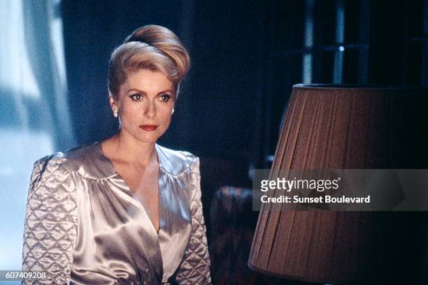 French actress Catherine Deneuve on the set of The Hunger, directed by Tony Scott.