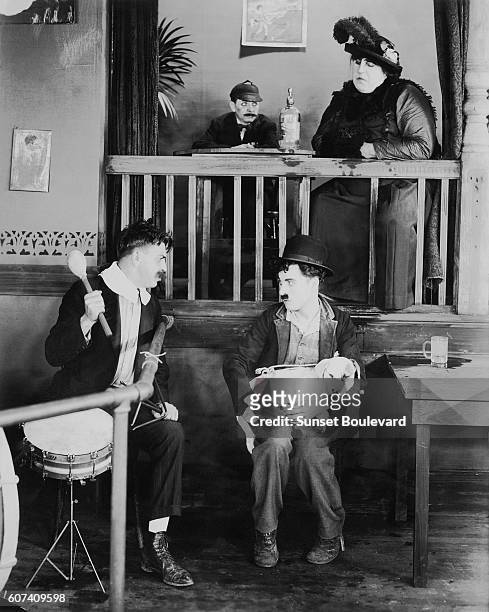 British actor, director, screenwriter and producer Sir Charles Spencer "Charlie" Chaplin on the set of his movie A Dog's Life.