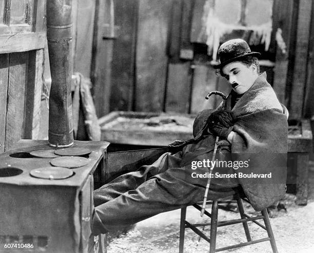 British actor, director, screenwriter and producer Sir Charles Spencer "Charlie" Chaplin on the set of his movie The Gold Rush.