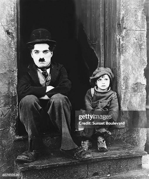 American actor Jackie Coogan with British actor, director, screenwriter and producer Sir Charles Spencer "Charlie" Chaplin on the set of his movie...