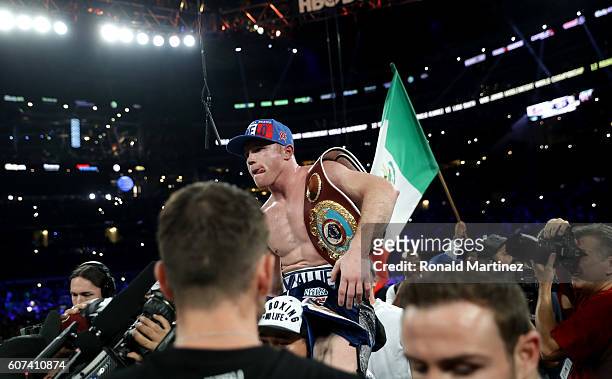 Canelo Alvarez celebrates after knocking out Liam Smith during the WBO Junior Middleweight World fight at AT&T Stadium on September 17, 2016 in...