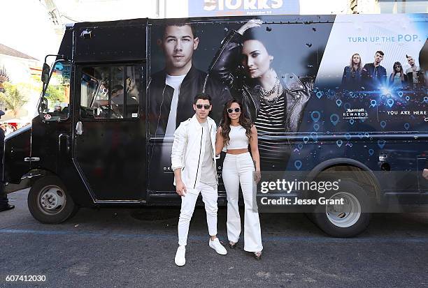 Nick Jonas and Demi Lovato hand out sweet treats and tickets to Demi Lovato's sold out show for Marriott Rewards Members in Los Angeles next week at...