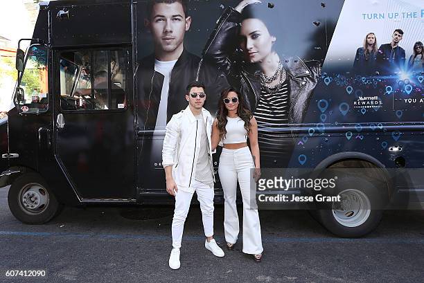 Nick Jonas and Demi Lovato hand out sweet treats and tickets to Demi Lovato's sold out show for Marriott Rewards Members in Los Angeles next week at...