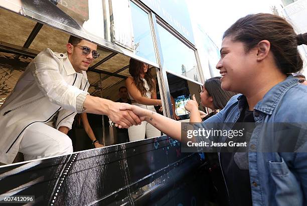 Nick Jonas hands out sweet treats and tickets to Demi Lovato's sold out show for Marriott Rewards Members in Los Angeles next week at TCL Chinese...