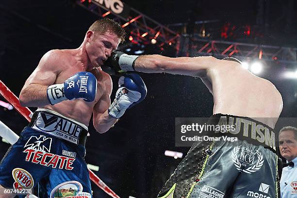 Liam Smith, right, fights Canelo Alvarez, left, during the WBO Junior Middleweight World fight at AT&T Stadium on September 17, 2016 in Arlington,...