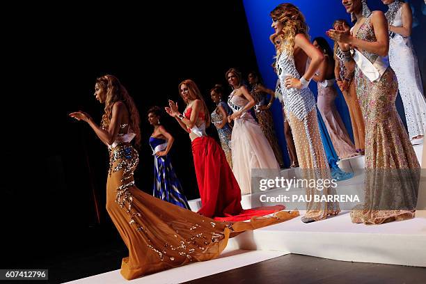 Miss Nigeria Miss saHHara applauds the crowd during the Miss Trans Star International beauty pageant in Cornella de Llobregat on September 18, 2016....