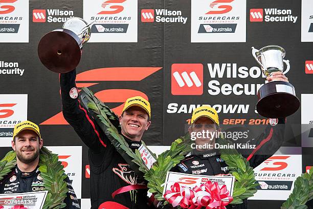 Garth Tander and Warren Luff drivers of the Holden Racing Team Holden Commodore VF celebrate on the podium after winning the Sandown 500 at Sandown...