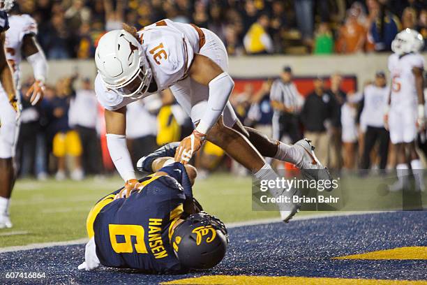 Wide receiver Chad Hansen of the California Golden Bears catches a 12-yard pass for the winning touchdown against safety Jason Hall of the Texas...