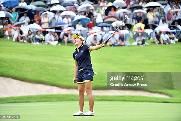 Misuzu Narita of Japan reacts after missing her putt on the 18th green during the Final round of the Munsingwear Ladies Tokai Classic 2016 at the...