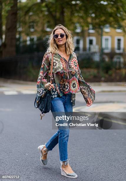 Anne-Laure Mais wearing a blouse, Chloe Lexa bag and denim jeans during London Fashion Week Spring/Summer collections 2017 on September 17, 2016 in...