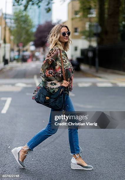 Anne-Laure Mais wearing a blouse, Chloe Lexa bag and denim jeans during London Fashion Week Spring/Summer collections 2017 on September 17, 2016 in...