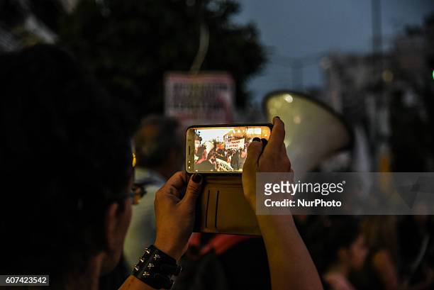 Protesters march through Keratsini neighbourhood during an anti-fascist rally in Piraeus on September 17, 2016. An anti-fascist and pro-refugee...