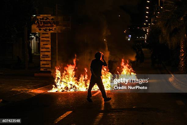 Minor clashes between protesters and police occur in Keratsini neighbourhood during an anti-fascist rally in Piraeus on September 17, 2016. An...