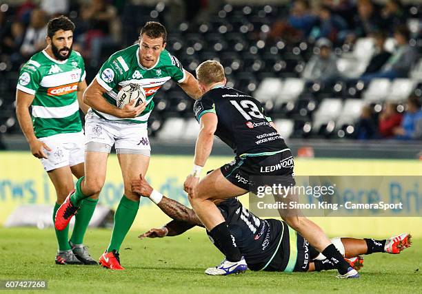 Alberto Sgarbi of Benetton Treviso evades the tackle of Josh Matavesi of Ospreys during the Guinness PRO12 Round 3 match between Ospreys and Benetton...