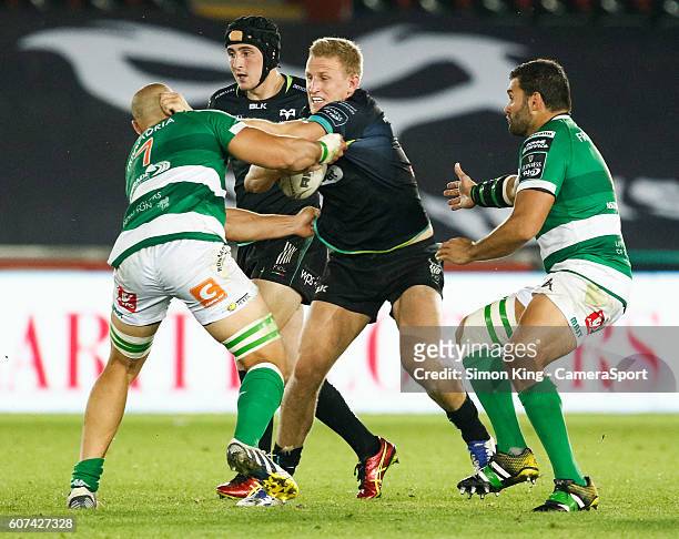 Ben John of Ospreys under pressure from Alberto De Marchi of Benetton Treviso during the Guinness PRO12 Round 3 match between Ospreys and Benetton...