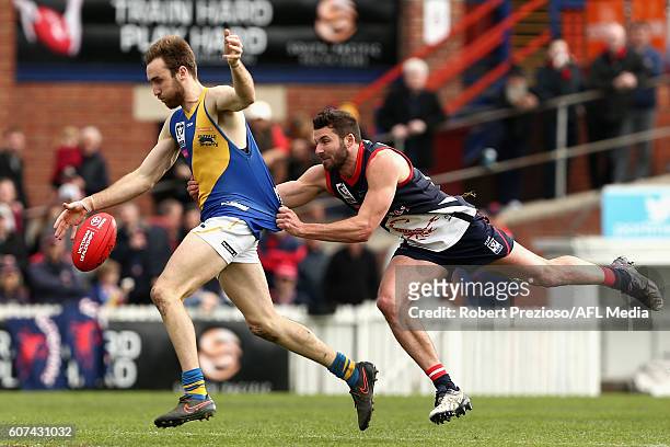 Sam Dunell of Williamstown is tackled during the VFL Preliminary Final match between the Casey Scorpions and Williamstown at North Port Oval on...