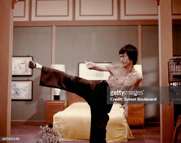Chinese American martial artist and actor Bruce Lee on the set of Enter the Dragon, directed by Robert Clouse.