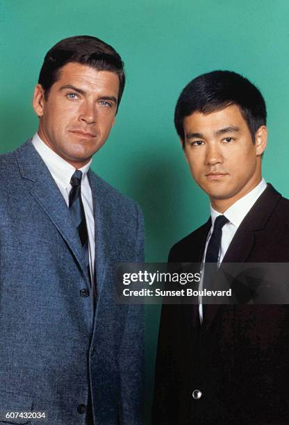 American actor Van Williams and Chinese American martial artist and actor Bruce Lee on the set of TV series The Green Hornet, created by George W....