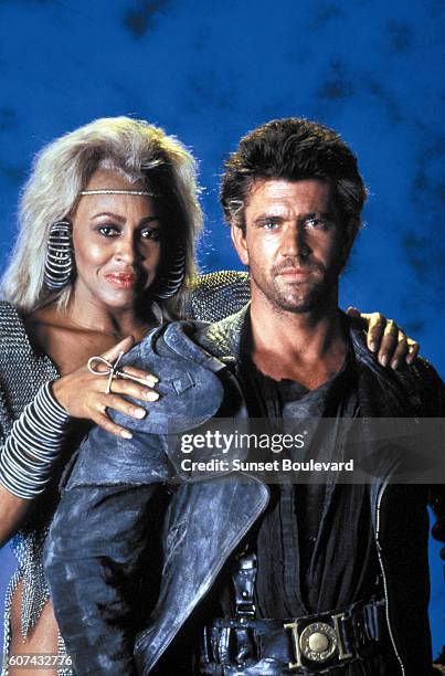 American actress and singer Tina Turner and actor Mel Gibson on the set of Mad Max Beyond Thunderdome, directed by George Miller and George Ogilvie.