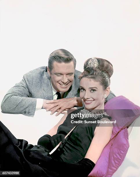 American George Peppard and British actress Audrey Hepburn on the set of Breakfast at Tiffany's, based on the novel by Truman Capote and directed by...